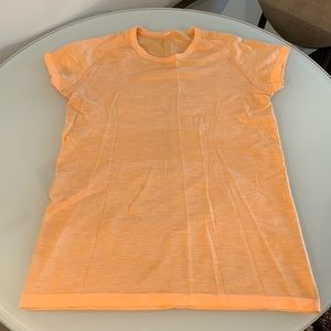 Lululemon tangerine swiftly t shirt, size 12.